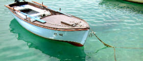 Photo of a boat in clear turquoise water